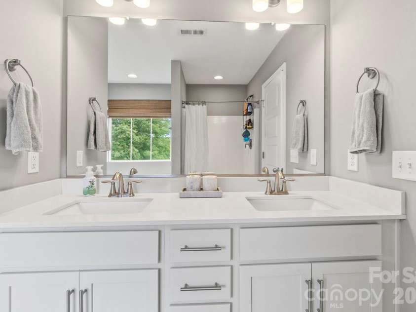 139 Wade Eaton Drive, Mocksville, NC 27028.  MLS# CAR4396137, YatesRealty ID 33812. Second bath showing dual vanities