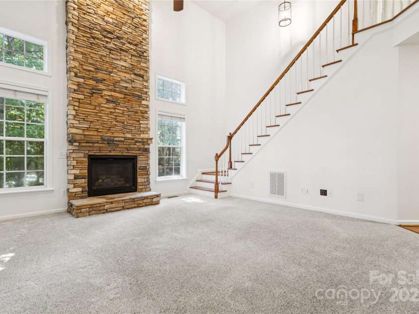 1627 Scotch Pine Lane, Tega Cay, SC 29708.  MLS# CAR4281753, YatesRealty ID 33813. 2-story vaulted ceiling with second staircase to upstairs