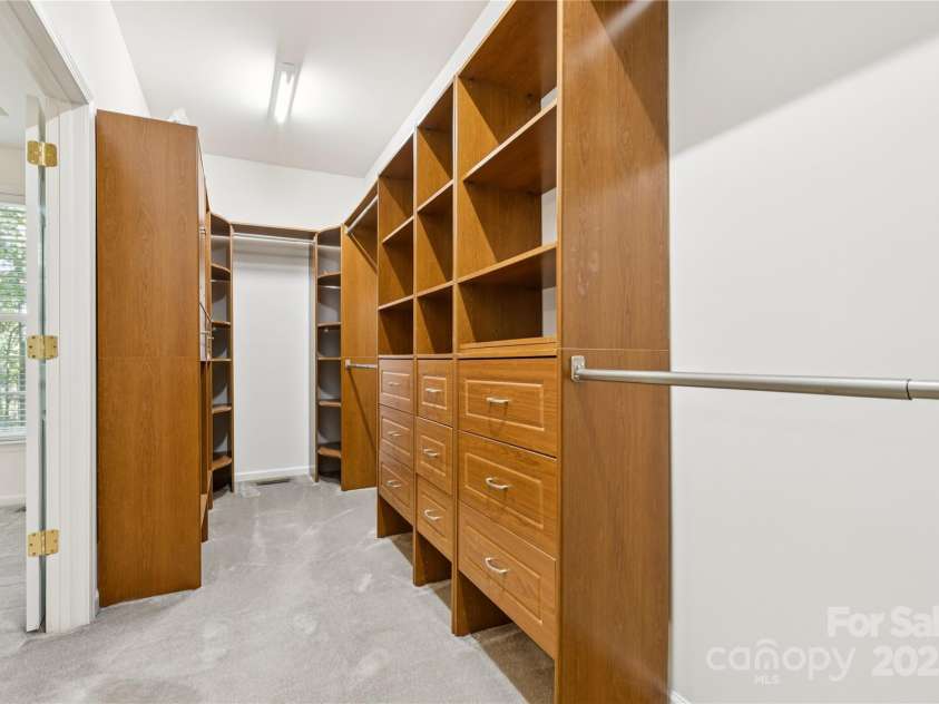 1627 Scotch Pine Lane, Tega Cay, SC 29708.  MLS# CAR4281753, YatesRealty ID 33813. Custom closet organizer in walk in closet