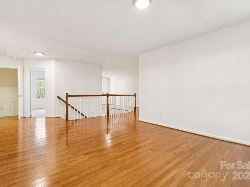 1627 Scotch Pine Lane, Tega Cay, SC 29708.  MLS# CAR4281753, YatesRealty ID 33813. Loft featuring solid hardwood floors