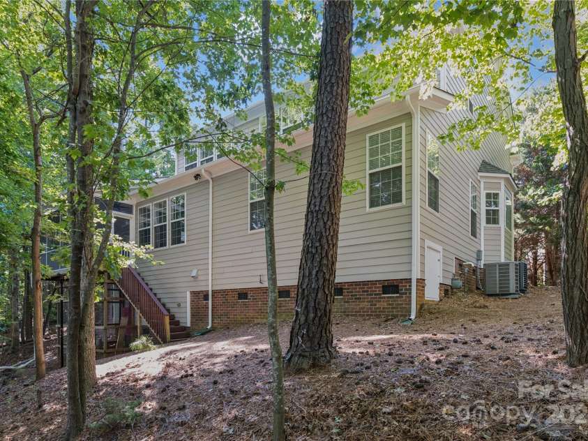 1627 Scotch Pine Lane, Tega Cay, SC 29708.  MLS# CAR4281753, YatesRealty ID 33813. Nestled within the wooded lot