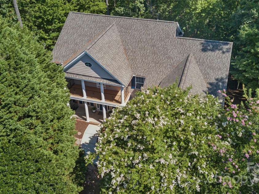 1627 Scotch Pine Lane, Tega Cay, SC 29708.  MLS# CAR4281753, YatesRealty ID 33813. Private, wooded retreat!