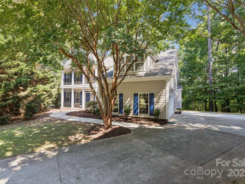 1627 Scotch Pine Lane, Tega Cay, SC 29708.  MLS# CAR4281753, YatesRealty ID 33813. Private, wooded retreat