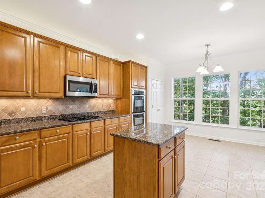 1627 Scotch Pine Lane, Tega Cay, SC 29708.  MLS# CAR4281753, YatesRealty ID 33813. Stainless steel appliances with gas cooktop