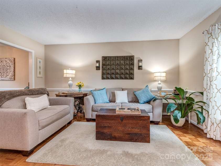 8715 Parkchester Drive, Charlotte, NC 28277.  MLS# CAR4288901, YatesRealty ID 33815. Formal Living Room is Spacious has chair rail and Pristine Parquet Wood Floors