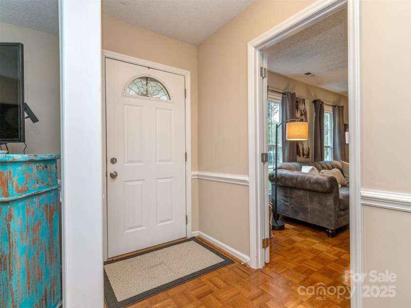 8715 Parkchester Drive, Charlotte, NC 28277.  MLS# CAR4288901, YatesRealty ID 33815. Lovely foyer with pristine Parquet Wood Floors