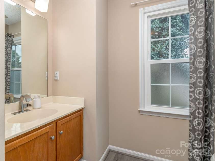 8715 Parkchester Drive, Charlotte, NC 28277.  MLS# CAR4288901, YatesRealty ID 33815. Main floor powder room & Laundry
