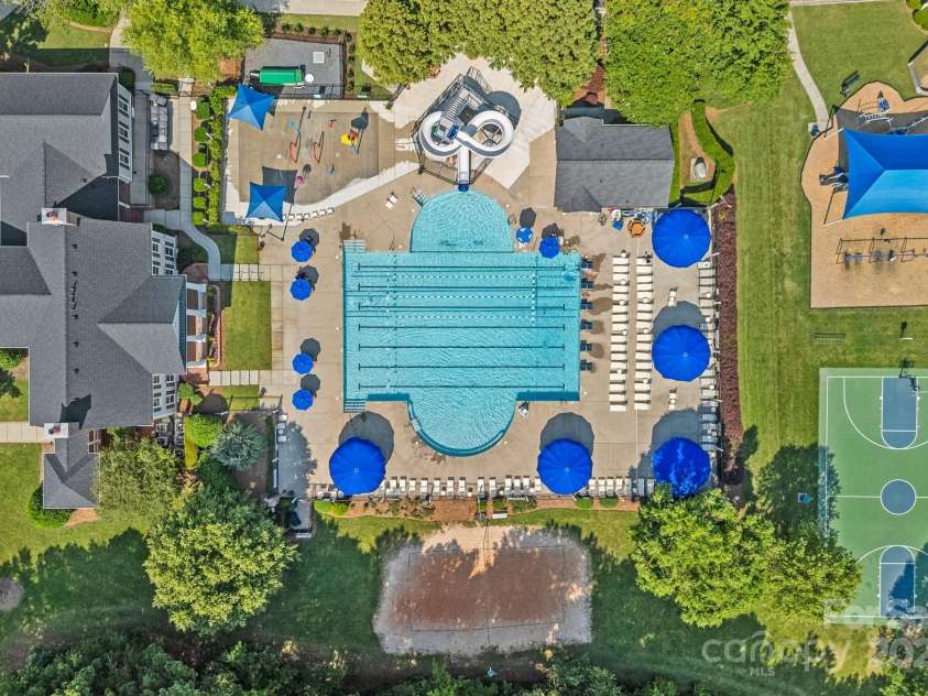 17018 Laurelmont Court, Fort Mill, SC 29707.  MLS# CAR4278414, YatesRealty ID 33822. Community pool with splash pad and slide, clubhouse, and beach volleyball court