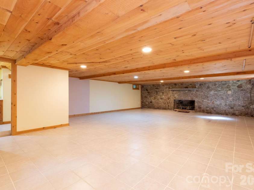 107 Cabin Fever Trail, Maggie Valley, NC 28751.  MLS# CAR4288888, YatesRealty ID 33824. Basement Family Room - low ceiling