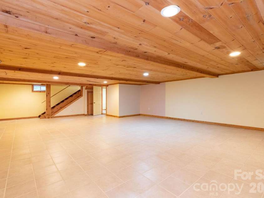 107 Cabin Fever Trail, Maggie Valley, NC 28751.  MLS# CAR4288888, YatesRealty ID 33824. Basement Family Room - low ceiling