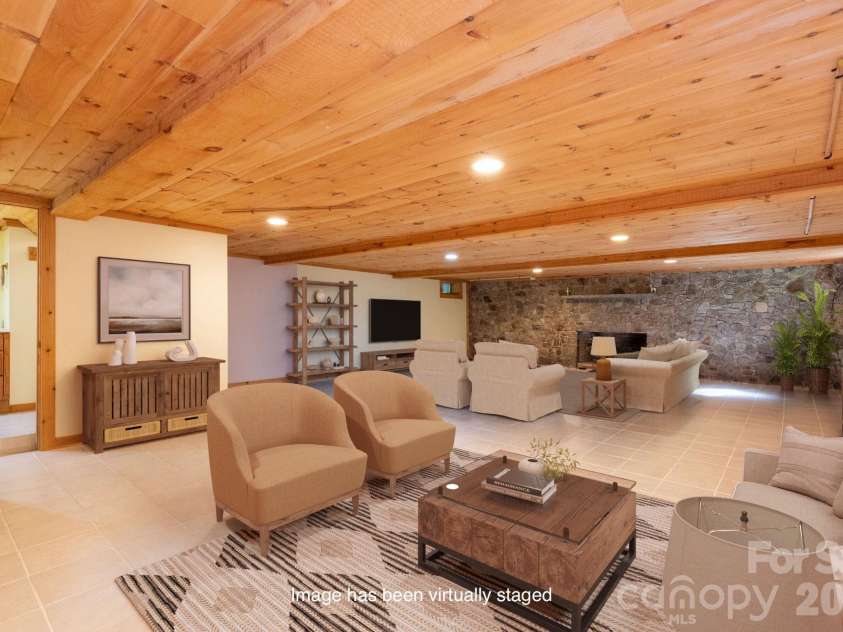 107 Cabin Fever Trail, Maggie Valley, NC 28751.  MLS# CAR4288888, YatesRealty ID 33824. Basement Family Room - Virtually Staged