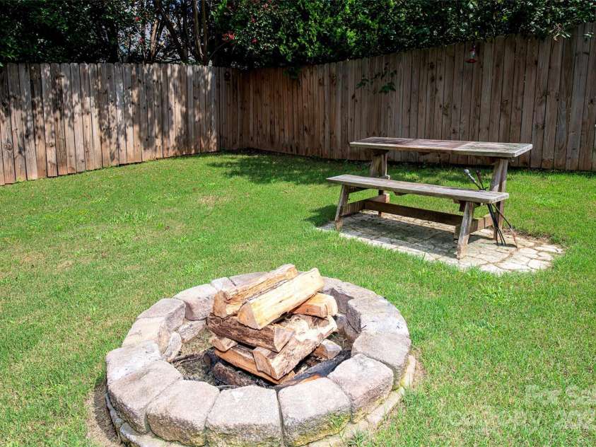 14237 Quartz Lane, Pineville, NC 28134.  MLS# CAR4291875, YatesRealty ID 33826. Firepit area