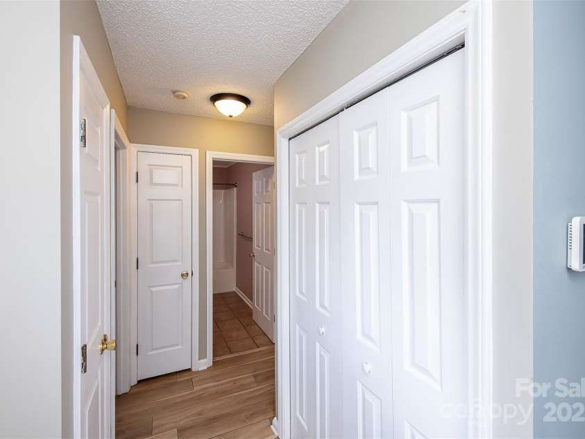 14237 Quartz Lane, Pineville, NC 28134.  MLS# CAR4291875, YatesRealty ID 33826. Hallway to secondary bedrooms