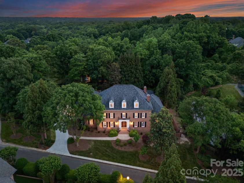 3314 Leamington Lane, Charlotte, NC 28226.  MLS# CAR4252556, YatesRealty ID 33832. Aerial view showcasing the front of the home and surrounding privacy trees.