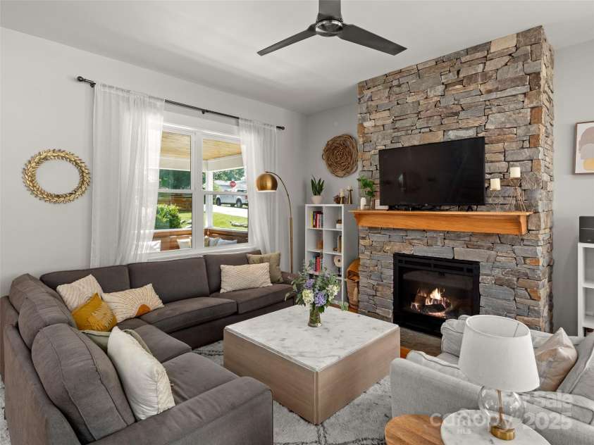 9 Pennsylvania Avenue, Asheville, NC 28806.  MLS# CAR4270881, YatesRealty ID 33836. Cozy gas log fireplace in the living room.