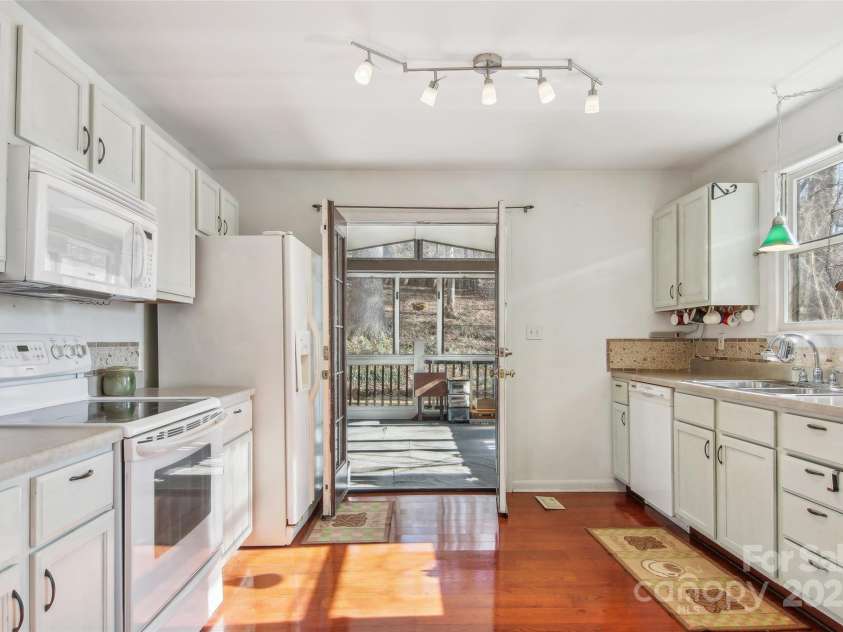 224 Beverly Road, Asheville, NC 28805.  MLS# CAR4278011, YatesRealty ID 33837. Kitchen to three Season Porch