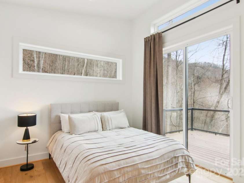 584 Walnut Cove Ridge, Bryson City, NC 28713.  MLS# CAR4232880, YatesRealty ID 3385. 2nd Bedroom with access to Front Deck