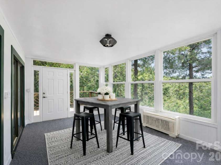 5545 Pine Ridge Drive, Connelly Springs, NC 28612.  MLS# CAR4344436, YatesRealty ID 33850. Large Sunroom w/ Year-Round Long-Range Mountain Views *Photo has been virtually enhanced.*