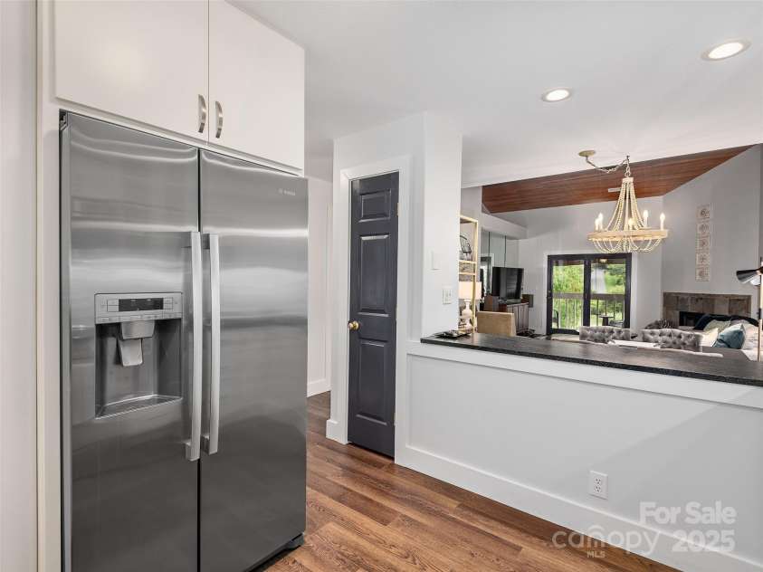 13 Timberlake Drive, Asheville, NC 28803.  MLS# CAR4289602, YatesRealty ID 33852. Pantry closet & pass-through & all new wood floors