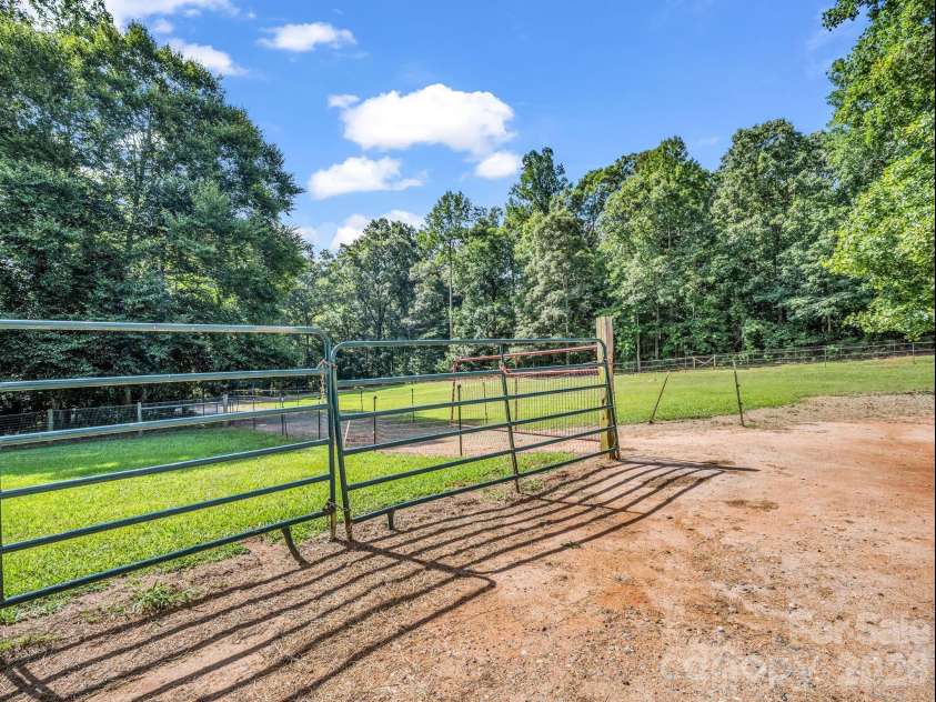 271 Collinsville Road, Columbus, NC 28722.  MLS# CAR4391485, YatesRealty ID 33858. Paddock behind barn