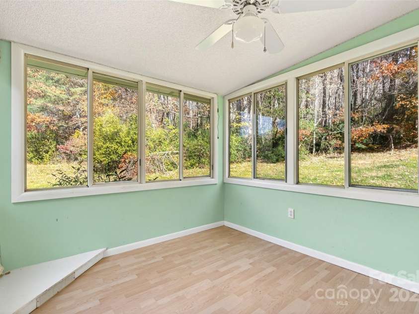 3B Lynx Drive, Black Mountain, NC 28711.  MLS# CAR4292052, YatesRealty ID 33858. Sunroom with lots of privacy Mtn Views