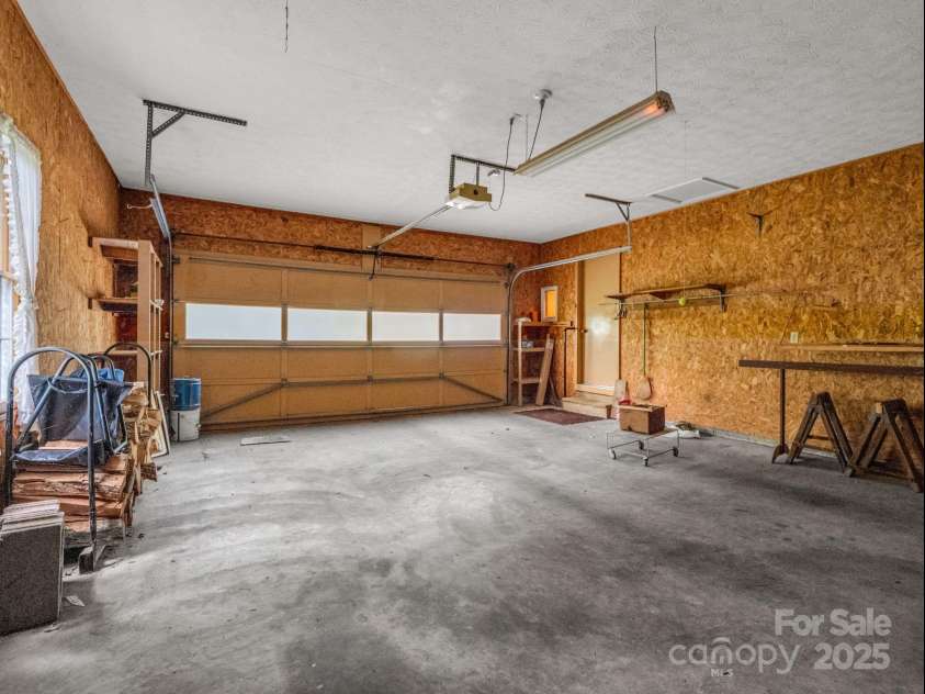 845 Greenwood Drive, Hendersonville, NC 28791.  MLS# CAR4290151, YatesRealty ID 33859. 2-car garage on main level