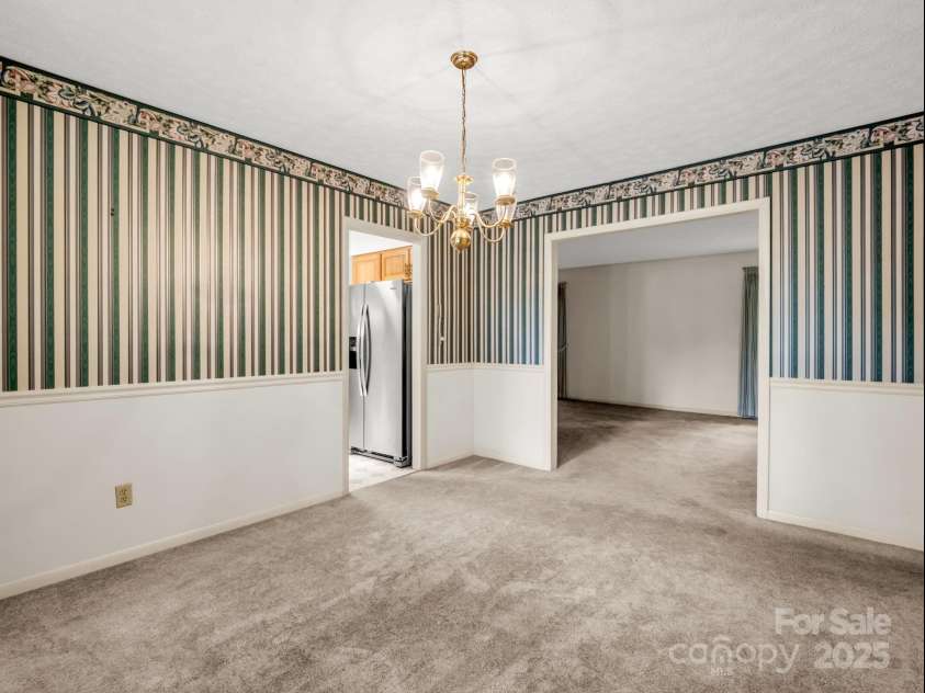 845 Greenwood Drive, Hendersonville, NC 28791.  MLS# CAR4290151, YatesRealty ID 33859. Living room flows to dining room