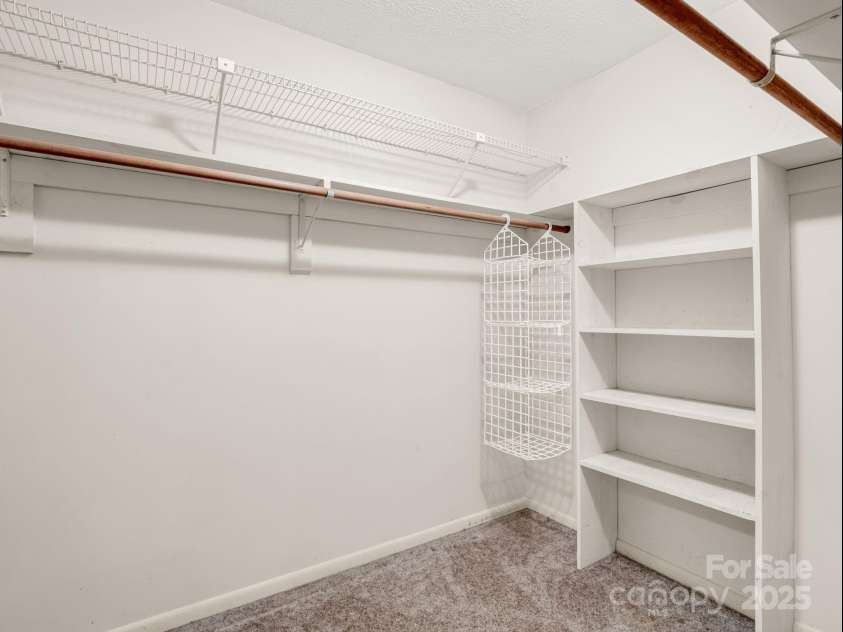 845 Greenwood Drive, Hendersonville, NC 28791.  MLS# CAR4290151, YatesRealty ID 33859. Walk-in closet in primary bedroom