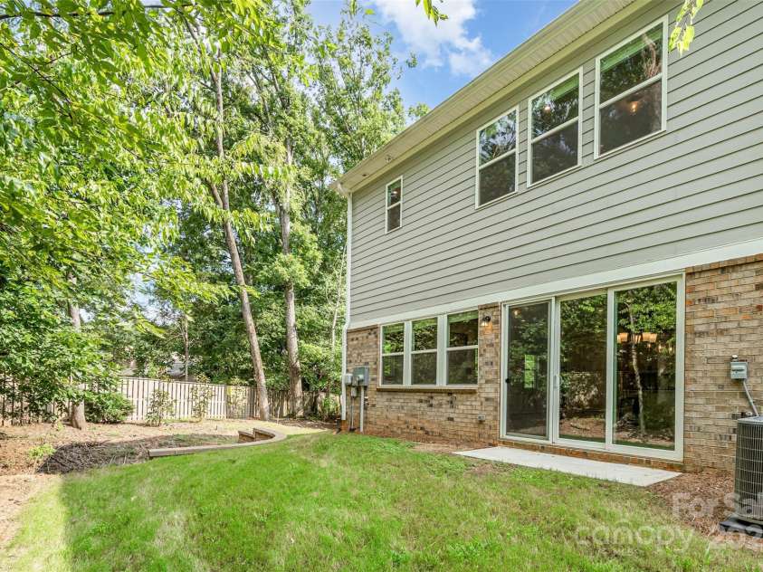 5025 Catterick Court, Charlotte, NC 28226.  MLS# CAR4198867, YatesRealty ID 33867. Backyard with view of Mature Trees