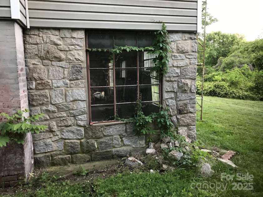 613 5th Street, Spencer, NC 29159.  MLS# CAR4240935, YatesRealty ID 3387. Stone foundation for rear porch - needs new framing above.