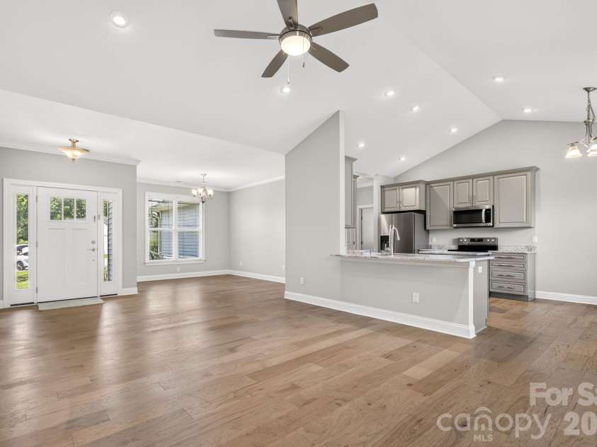 122 Cheraw Lane, Flat Rock, NC 28731.  MLS# CAR4395581, YatesRealty ID 33875. Living Room into Kitchen
