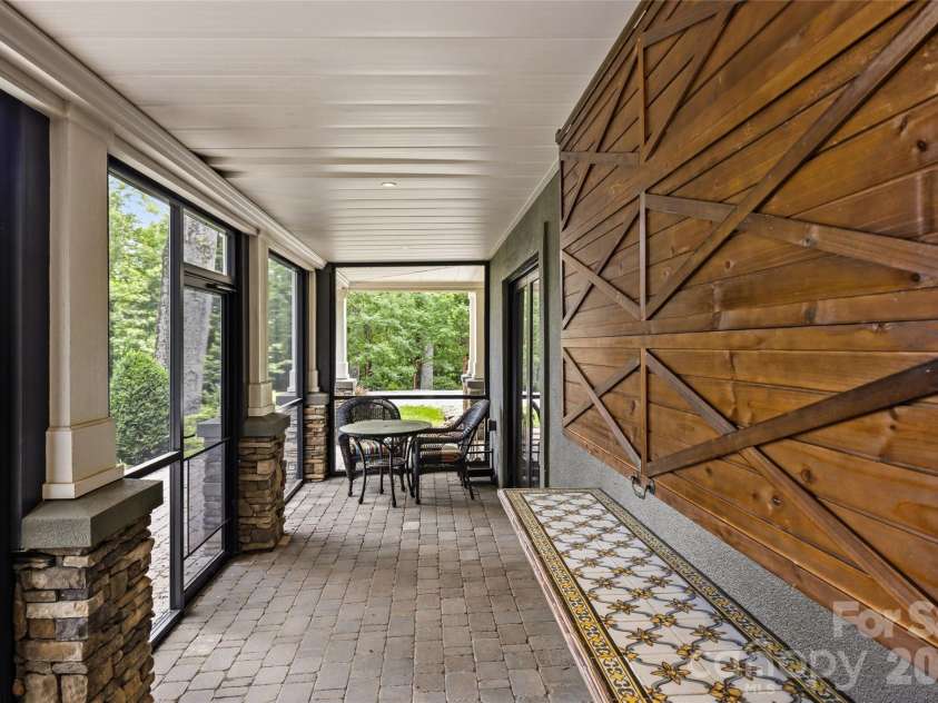 233 Tanglewood Lane, Saluda, NC 28773.  MLS# CAR4393115, YatesRealty ID 33883. Back screened porch on lower level.