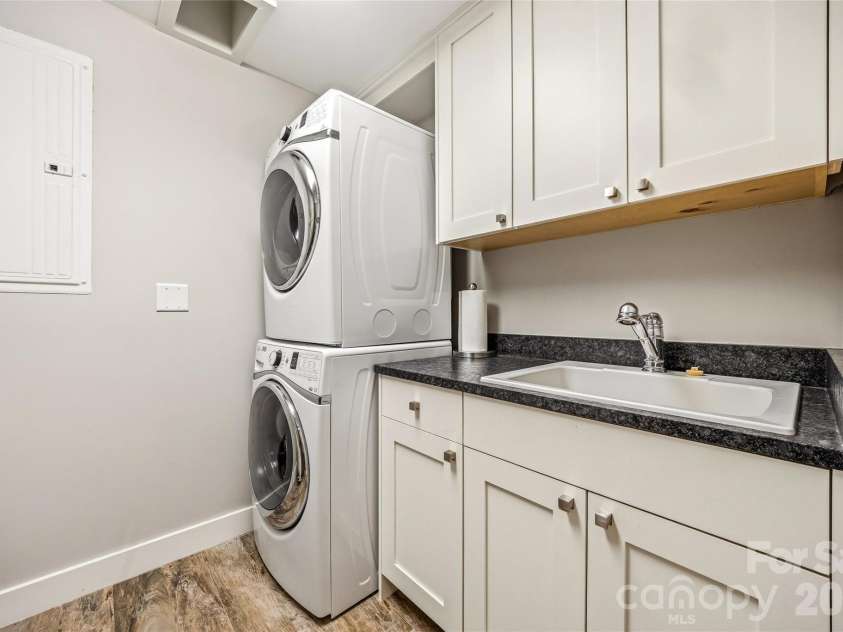 233 Tanglewood Lane, Saluda, NC 28773.  MLS# CAR4393115, YatesRealty ID 33883. Downstairs laundry