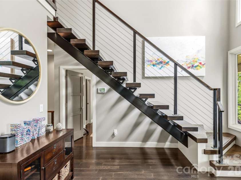 233 Tanglewood Lane, Saluda, NC 28773.  MLS# CAR4393115, YatesRealty ID 33883. Stairs to second level