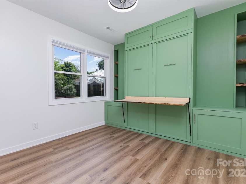 7308 Barn Stone Drive, Charlotte, NC 28227.  MLS# CAR4278388, YatesRealty ID 33885. 3rd bedroom with built-in desk, shelves and pull-down Murphy bed