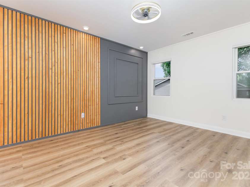 7308 Barn Stone Drive, Charlotte, NC 28227.  MLS# CAR4278388, YatesRealty ID 33885. Primary bedroom with accent wall
