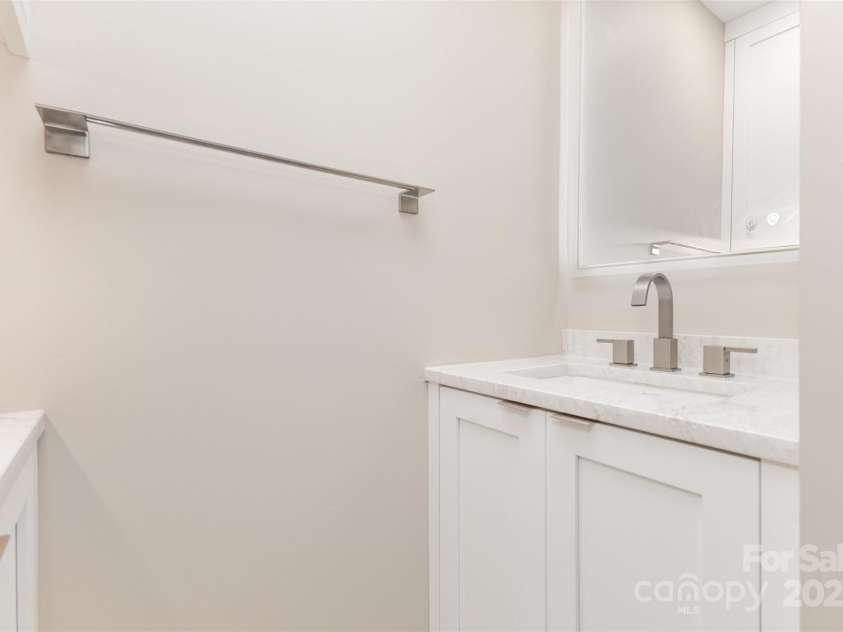 7308 Barn Stone Drive, Charlotte, NC 28227.  MLS# CAR4278388, YatesRealty ID 33885. Second vanity area in primary bathroom