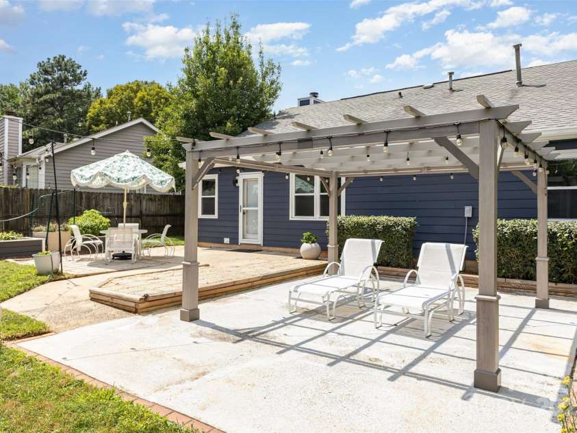 7308 Barn Stone Drive, Charlotte, NC 28227.  MLS# CAR4278388, YatesRealty ID 33885. Spacious patio for entertaining. Pergola to convey