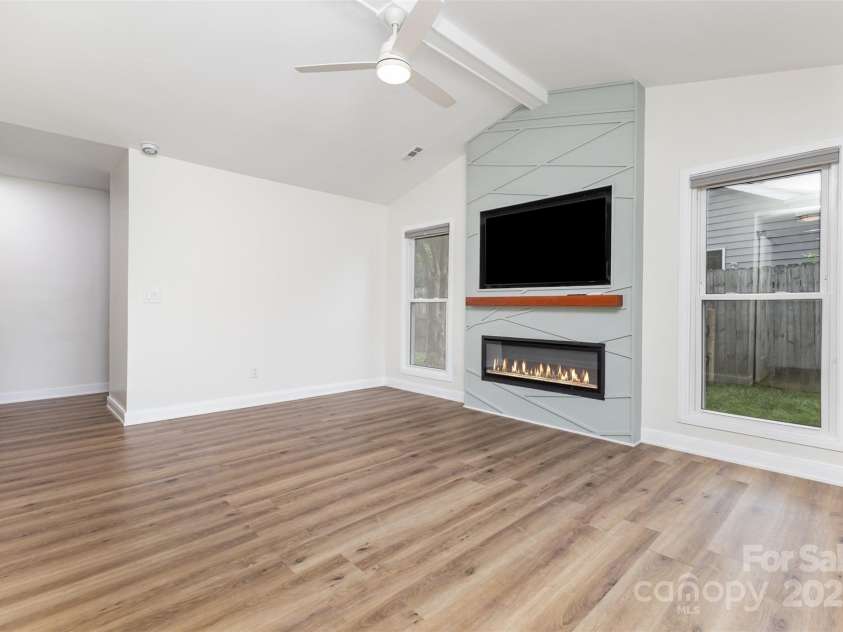 7308 Barn Stone Drive, Charlotte, NC 28227.  MLS# CAR4278388, YatesRealty ID 33885. Updated electric fireplace and mantle area