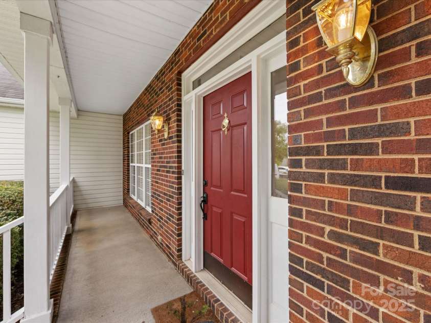 12316 Heritage Hills Lane, Charlotte, NC 28269.  MLS# CAR4285911, YatesRealty ID 33886. Covered front porch
