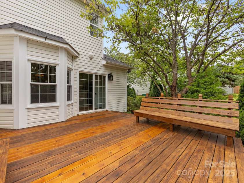 12316 Heritage Hills Lane, Charlotte, NC 28269.  MLS# CAR4285911, YatesRealty ID 33886. Expansive deck off of the kitchen for easy grilling