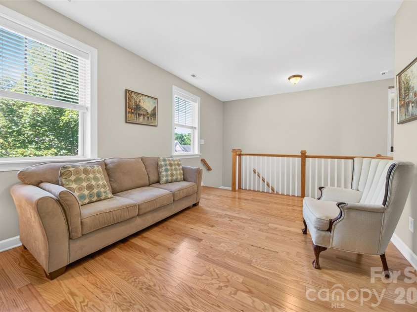 103 Cranbrook Lane, Mooresville, NC 28117.  MLS# CAR4392478, YatesRealty ID 33887. Generously sized flex space at the top of the stairs bathed in natural light.