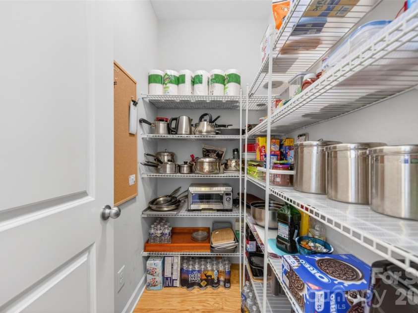 103 Cranbrook Lane, Mooresville, NC 28117.  MLS# CAR4392478, YatesRealty ID 33887. Generously sized walk-in pantry with abundant storage for kitchen essentials and dry goods.