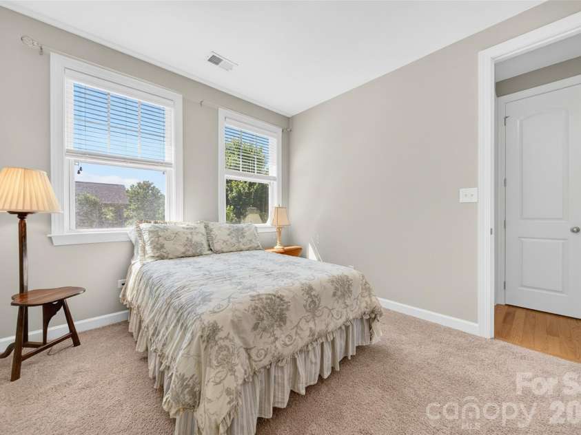 103 Cranbrook Lane, Mooresville, NC 28117.  MLS# CAR4392478, YatesRealty ID 33887. Well-appointed guest bedroom with a private en suite bath access.