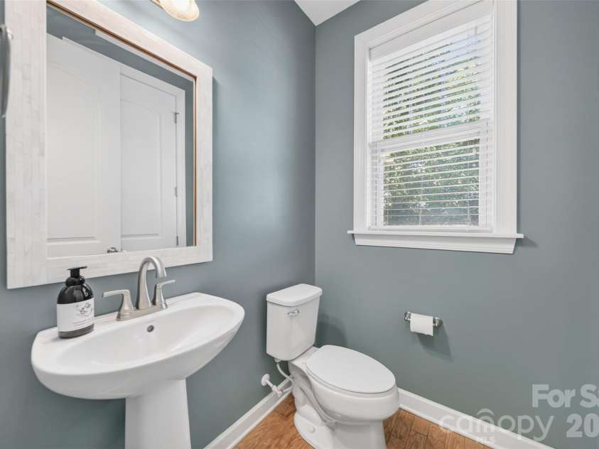 103 Cranbrook Lane, Mooresville, NC 28117.  MLS# CAR4392478, YatesRealty ID 33887. Well-appointed powder room conveniently located on the main level.