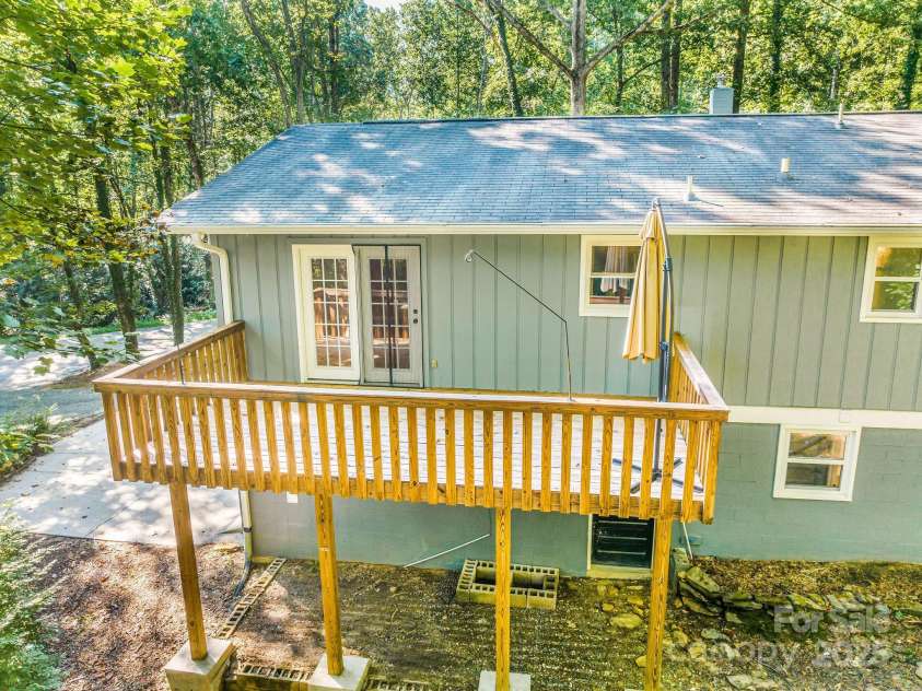 87 Crows Nest Road, Hendersonville, NC 28791.  MLS# CAR4292116, YatesRealty ID 33892. Back deck off dining room