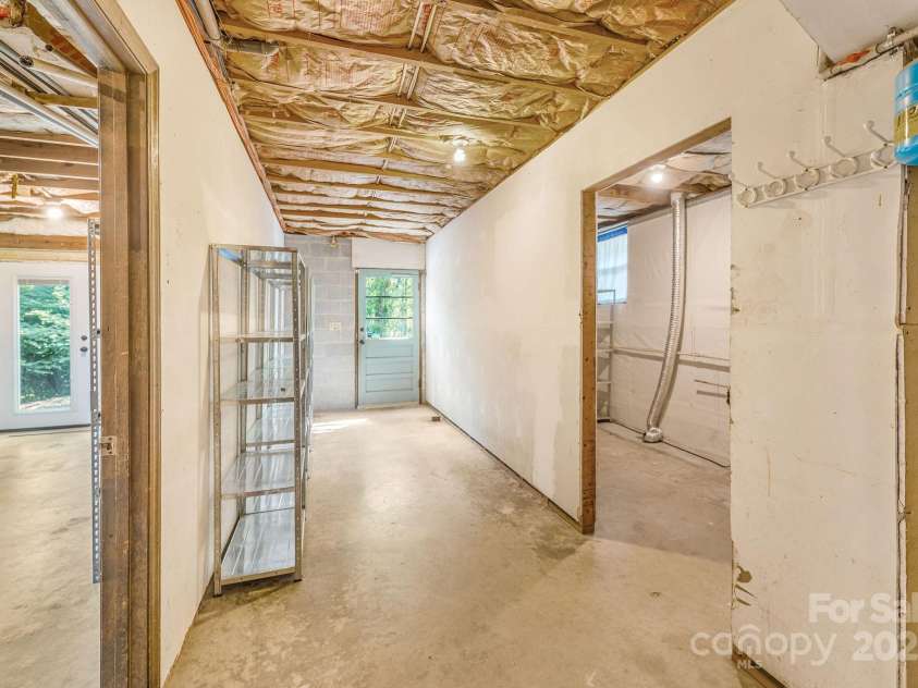 87 Crows Nest Road, Hendersonville, NC 28791.  MLS# CAR4292116, YatesRealty ID 33892. Basement space on lower level