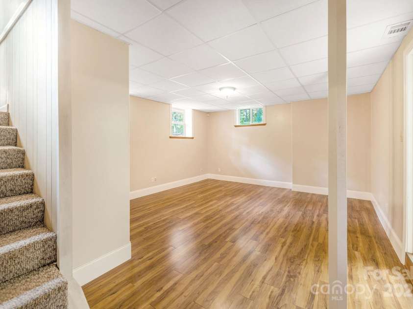 87 Crows Nest Road, Hendersonville, NC 28791.  MLS# CAR4292116, YatesRealty ID 33892. Downstairs Second living room/den