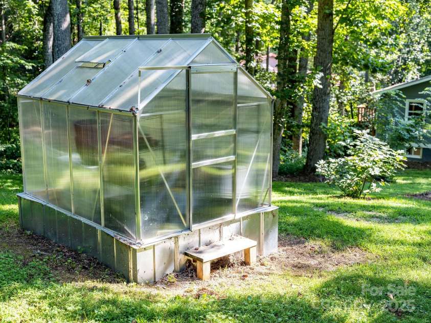 87 Crows Nest Road, Hendersonville, NC 28791.  MLS# CAR4292116, YatesRealty ID 33892. New green house conveys