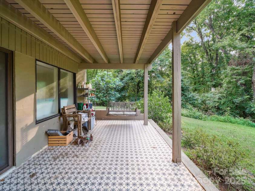 13831 Woody Point Road, Charlotte, NC 28278.  MLS# CAR4283409, YatesRealty ID 33894. Patio off basement bedroom